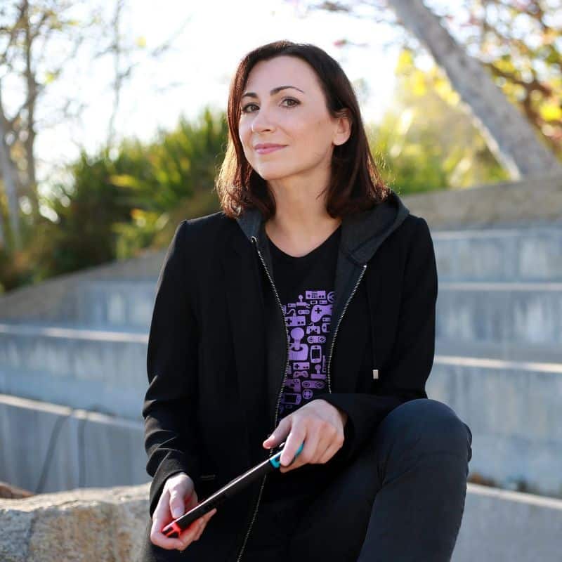 Portrait of Celia, a team member, seated outdoors